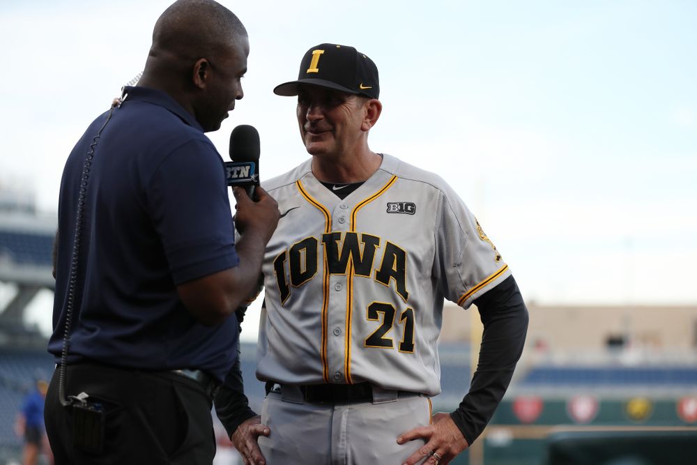 Iowa Hawkeyes head coach Rick Heller talks with Danan Hughes following their game against the Indiana Hoosiers in the first round of the Big Ten Baseball Tournament Wednesday, May 22, 2019 at TD Ameritrade Park in Omaha, Neb. (Brian Ray/hawkeyesports.com)