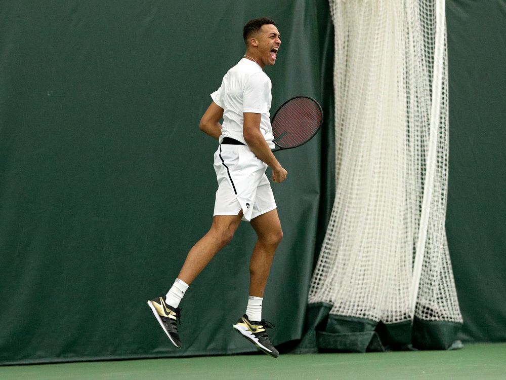 Iowa’s Oliver Okonkwo celebrates a point during his doubles match at the Hawkeye Tennis and Recreation Complex in Iowa City on Sunday, February 16, 2020. (Stephen Mally/hawkeyesports.com)