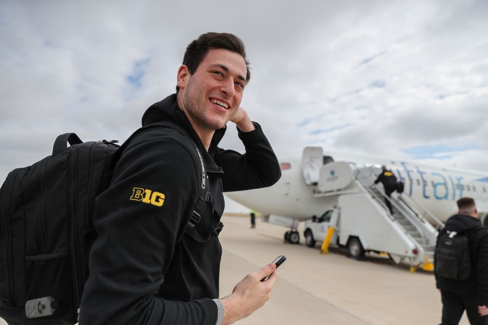 Iowa Hawkeyes forward Ryan Kriener (15) boards a flight to Columbus for the first and second rounds of the 2019 NCAA Men's Basketball Tournament Wednesday, March 20, 2019 at the Eastern Iowa Airport. (Brian Ray/hawkeyesports.com)