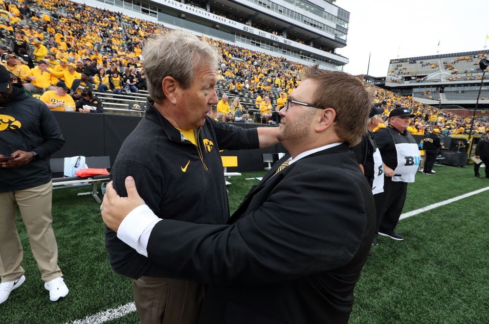 University of Iowa President Bruce Harreld talks with Hawkeye Marching Band Director Eric Bush before the Iowa Hawkeyes game against Middle Tennessee State Saturday, September 28, 2019 at Kinnick Stadium. (Brian Ray/hawkeyesports.com)