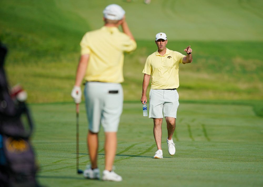 Iowa’s Matthew Garside (from left) talks with head coach Tyler Stith during the third day of the Golfweek Conference Challenge at the Cedar Rapids Country Club in Cedar Rapids on Tuesday, Sep 17, 2019. (Stephen Mally/hawkeyesports.com)