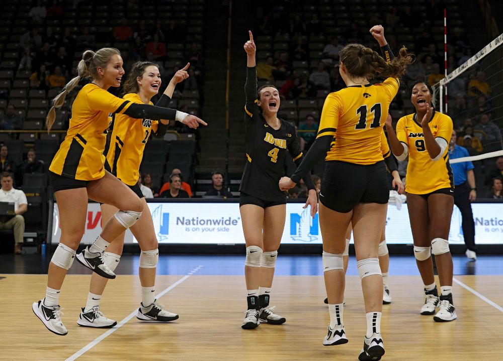 Iowa’s Maddie Slagle (15), Courtney Buzzerio (2), Halle Johnston (4), Blythe Rients (11), and Amiya Jones (9) celebrate a score during the second set of their match against Illinois at Carver-Hawkeye Arena in Iowa City on Wednesday, Nov 6, 2019. (Stephen Mally/hawkeyesports.com)