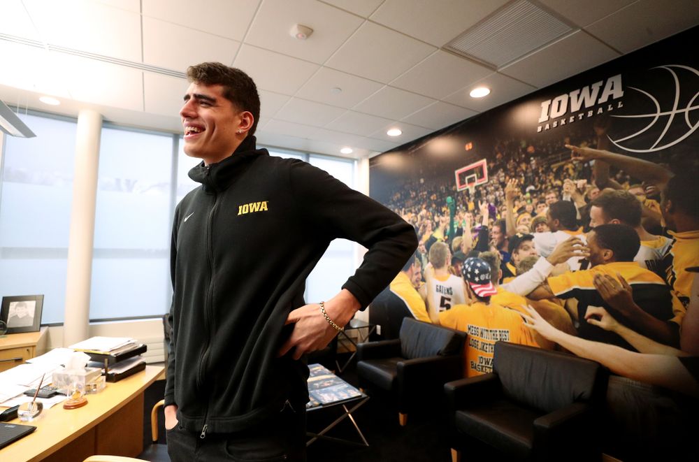 Iowa Hawkeyes forward Luka Garza (55) smiles after finding out that he has been named the Big Ten Player of the Year Monday, March 9, 2020 at Carver-Hawkeye Arena. (Brian Ray/hawkeyesports.com)