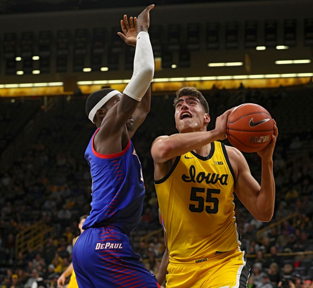 Iowa Hawkeyes center Luka Garza (55) fights to the basket during the first half of their game at Carver-Hawkeye Arena in Iowa City on Monday, Nov 11, 2019. (Stephen Mally/hawkeyesports.com)