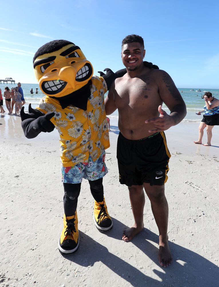 Herky The Hawk and Iowa Hawkeyes offensive lineman Tristan Wirfs (74) during the Outback Bowl Beach Day Sunday, December 30, 2018 at Clearwater Beach. (Brian Ray/hawkeyesports.com)