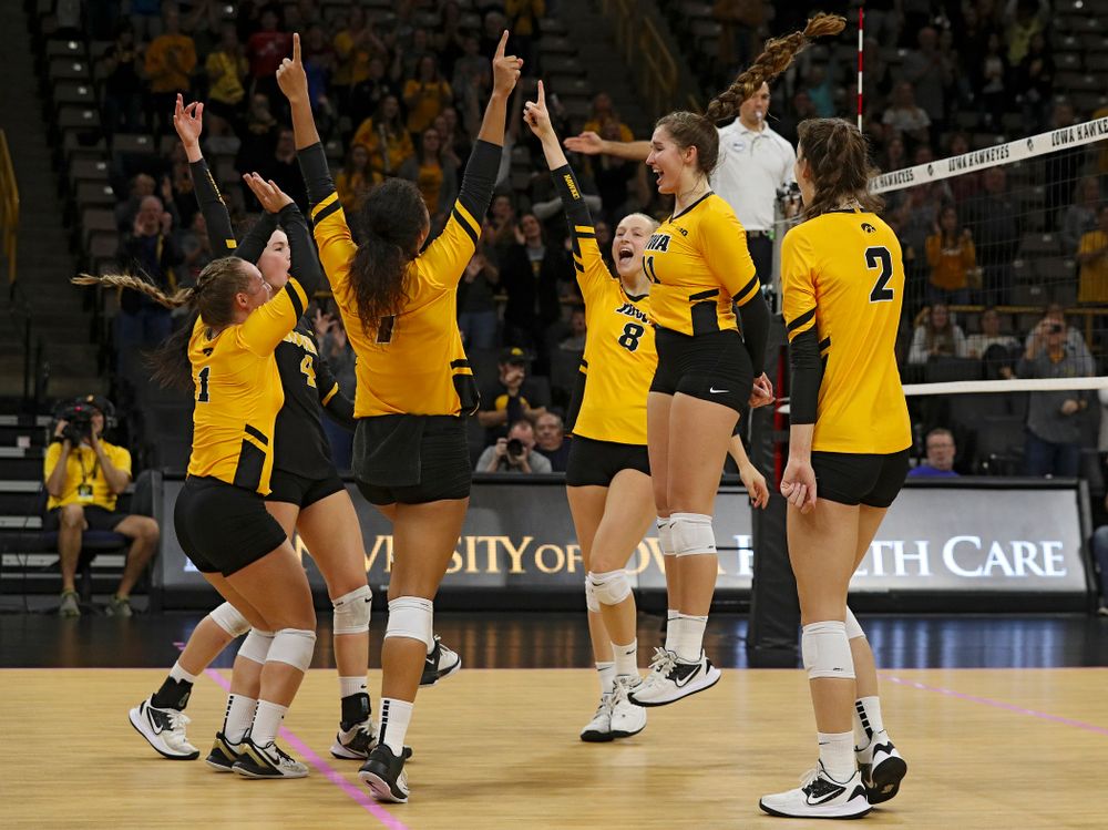 Iowa’s Joslyn Boyer (1), Halle Johnston (4), Brie Orr (7), Kyndra Hansen (8), Blythe Rients (11), and Courtney Buzzerio (2) celebrate a score during their match at Carver-Hawkeye Arena in Iowa City on Sunday, Oct 20, 2019. (Stephen Mally/hawkeyesports.com)