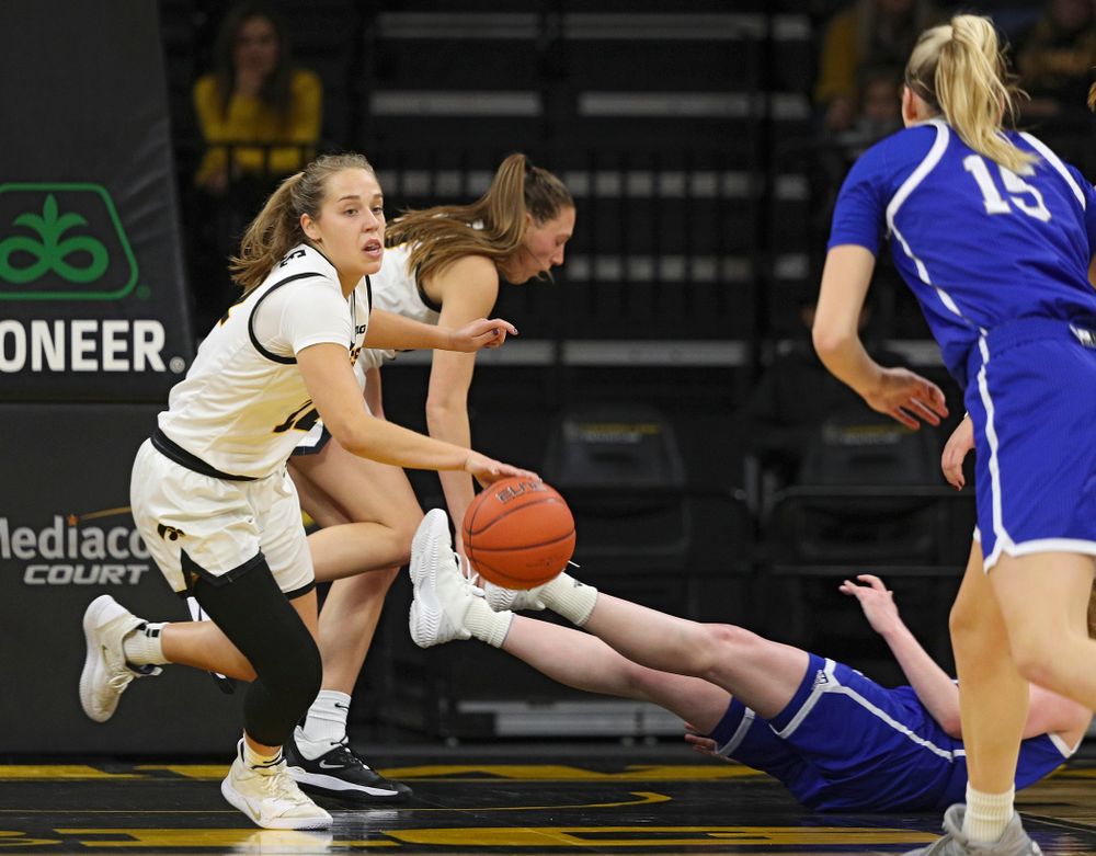 Iowa Hawkeyes guard Kathleen Doyle (22) steals the ball away during the first quarter of their game at Carver-Hawkeye Arena in Iowa City on Saturday, December 21, 2019. (Stephen Mally/hawkeyesports.com)