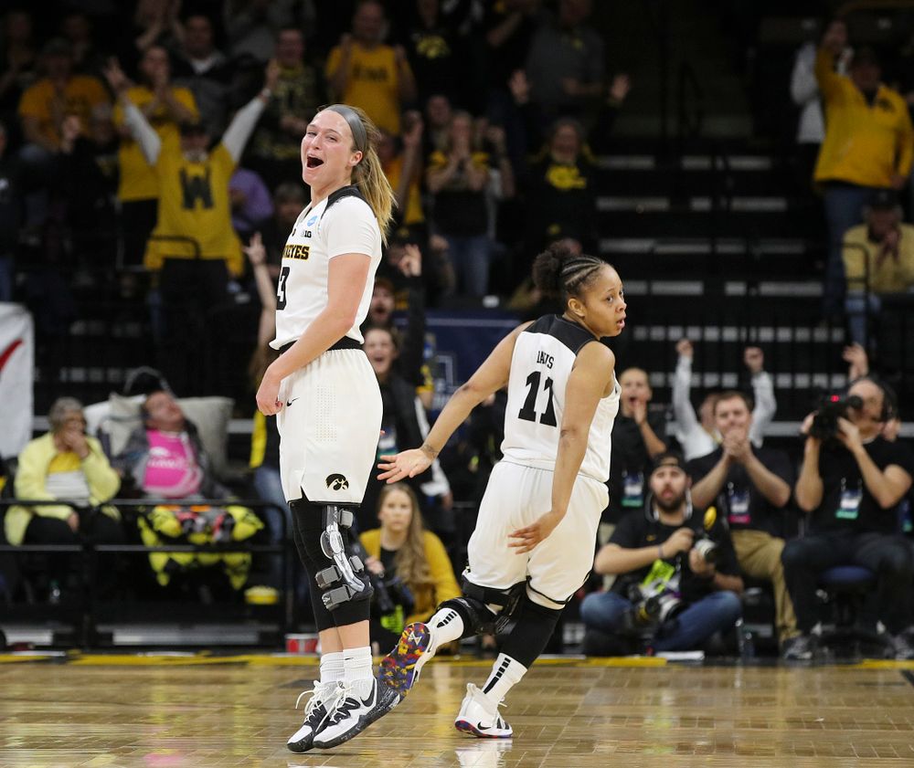 Iowa Hawkeyes guard Makenzie Meyer (3) is pumped up after making a 3-pointer as guard Tania Davis (11) looks on during the second quarter of their second round game in the 2019 NCAA Women's Basketball Tournament at Carver Hawkeye Arena in Iowa City on Sunday, Mar. 24, 2019. (Stephen Mally for hawkeyesports.com)