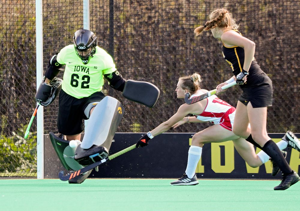 Iowa’s Grace McGuire (62) kicks a shot away for a save during the fourth quarter of their match at Grant Field in Iowa City on Friday, Oct 4, 2019. (Stephen Mally/hawkeyesports.com)