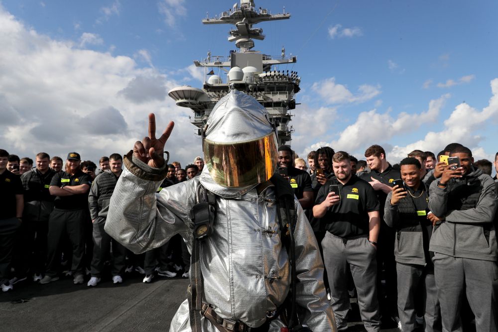 Iowa Hawkeyes running back Keontae Luckett (20) puts on a firefighting suit during a tour of the USS Theodore Roosevelt (CVN-71) Tuesday, December 24, 2019 at the Naval Base Coronado. (Brian Ray/hawkeyesports.com)