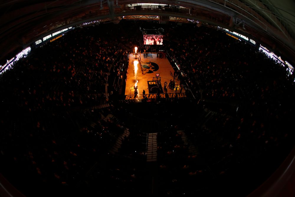 The Iowa Hawkeyes are introduced before their game 
