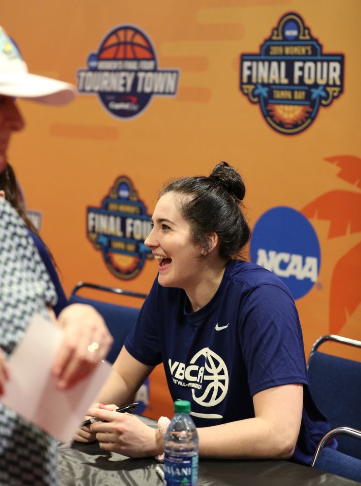 Iowa Hawkeyes forward Megan Gustafson (10) signs autographs with the other WBCA All Americans at the Tourney Town Fan Fest Friday, April 5, 2019 at the Tampa Convention Center in Tampa, FL. (Brian Ray/hawkeyesports.com)