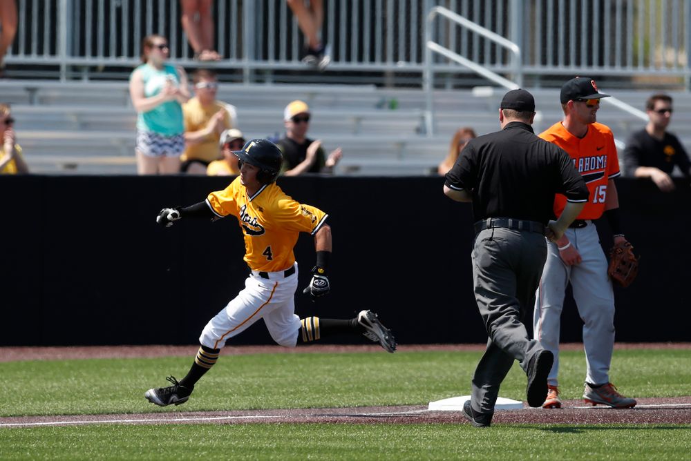 Iowa Hawkeyes infielder Mitchell Boe (4) hits an inside the park home run against the Oklahoma State Cowboys Sunday, May 6, 2018 at Duane Banks Field. (Brian Ray/hawkeyesports.com)