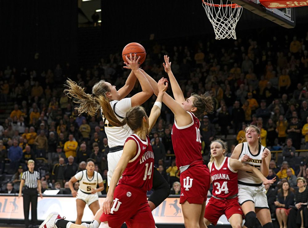 Iowa Hawkeyes guard Kathleen Doyle (22) makes a basket while being fouled during the fourth quarter of their game at Carver-Hawkeye Arena in Iowa City on Sunday, January 12, 2020. (Stephen Mally/hawkeyesports.com)