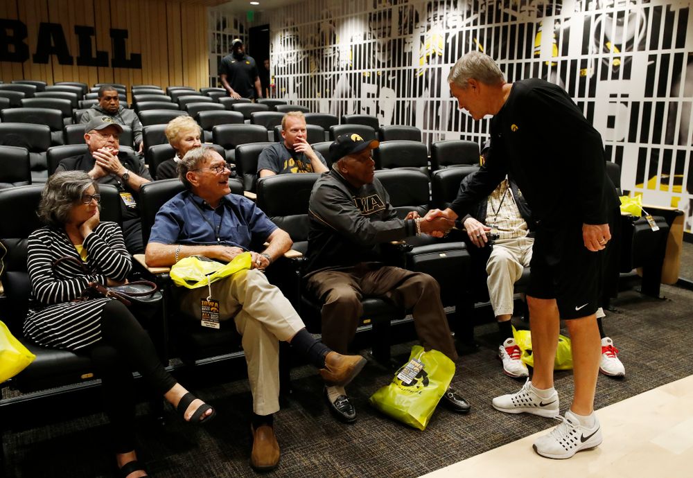 Iowa Hawkeyes head coach Kirk Ferentz shakes hands with 1958 National Championship Team running back Willie Fleming as they tour the Hansen Football Performance  Center  Friday, September 21, 2018. (Brian Ray/hawkeyesports.com)