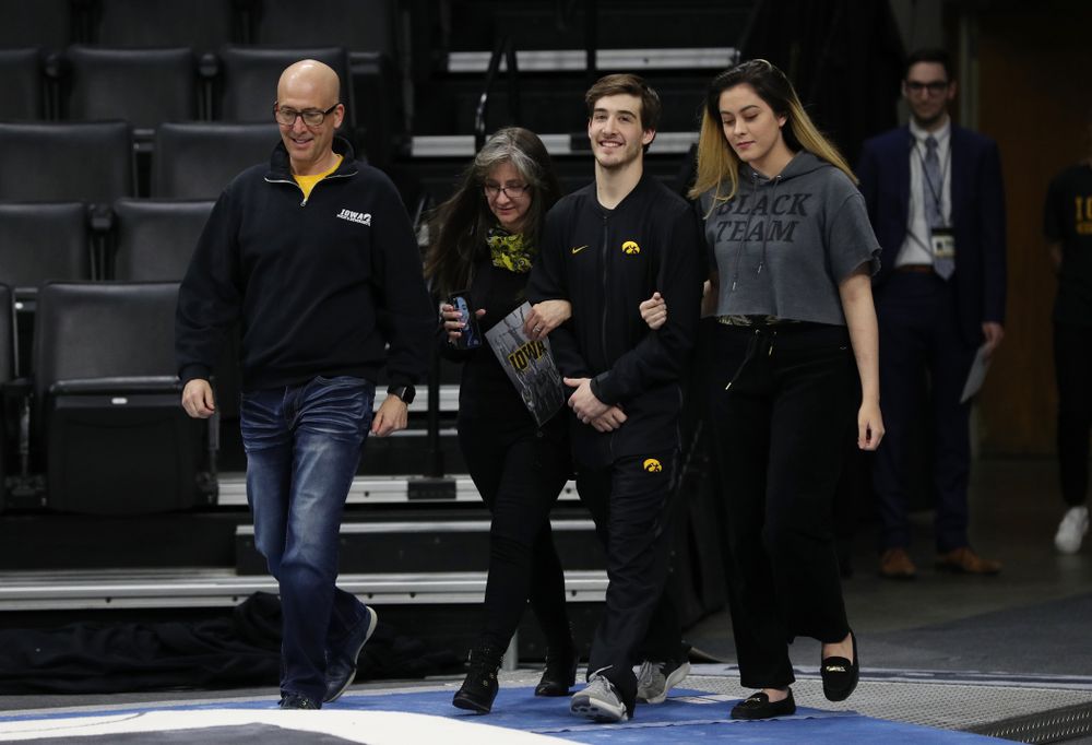 Iowa Men's Gymnast Kevin Johnson and his family during senior day ceremonies following their meet against the Ohio State Buckeyes  Saturday, March 16, 2019 at Carver-Hawkeye Arena.  (Brian Ray/hawkeyesports.com)