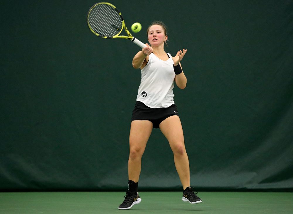 Iowa’s Danielle Burich returns a shot during her singles match at the Hawkeye Tennis and Recreation Complex in Iowa City on Sunday, February 23, 2020. (Stephen Mally/hawkeyesports.com)