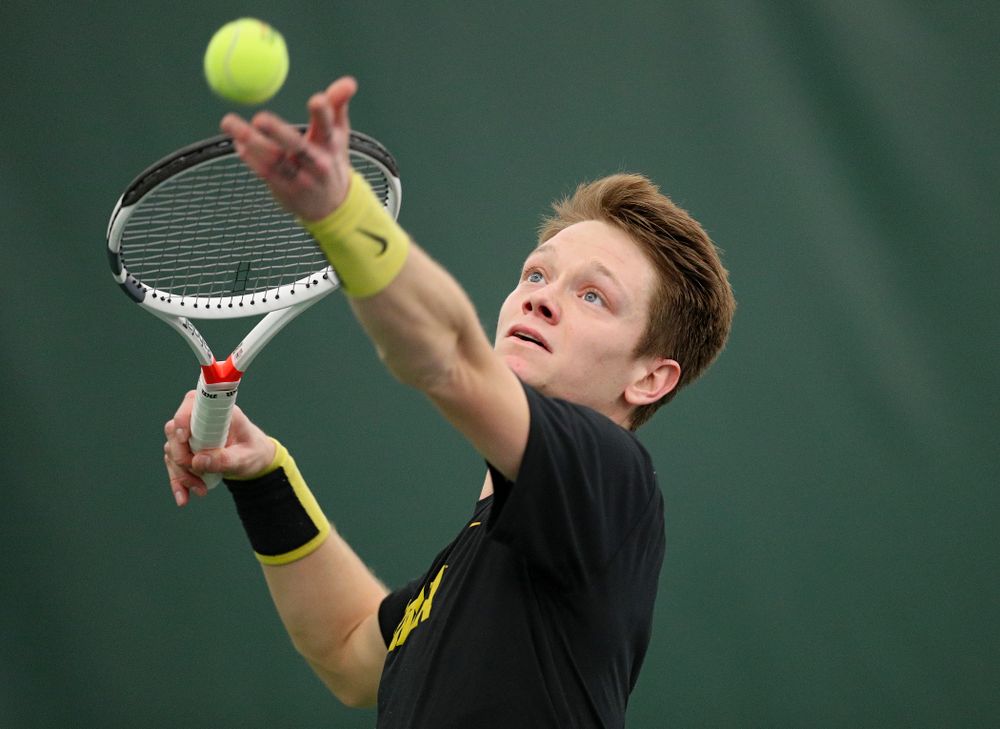 Iowa’s Jason Kerst serves during his match against Marquette at the Hawkeye Tennis and Recreation Complex in Iowa City on Saturday, January 25, 2020. (Stephen Mally/hawkeyesports.com)