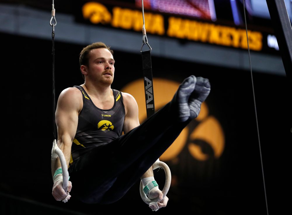 Dylan Ellsworth competes on the rings against Minnesota and Air Force 