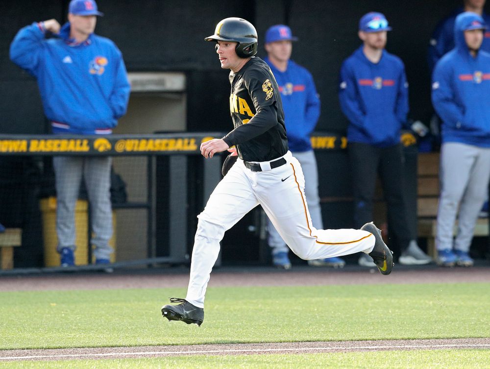 Iowa outfielder Ben Norman (9) scores a run during the fourth inning of their college baseball game at Duane Banks Field in Iowa City on Tuesday, March 10, 2020. (Stephen Mally/hawkeyesports.com)