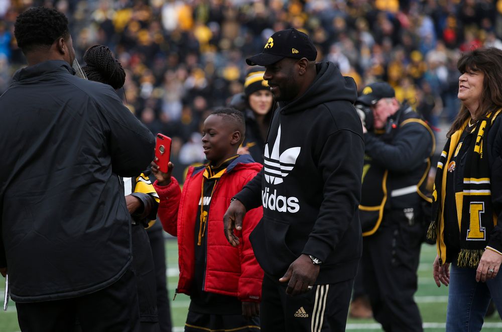 Iowa Hawkeyes linebacker Aaron Mends (31) is greeted by his family during Senior Day ceremonies before a game against Nebraska at Kinnick Stadium on November 23, 2018. (Tork Mason/hawkeyesports.com)