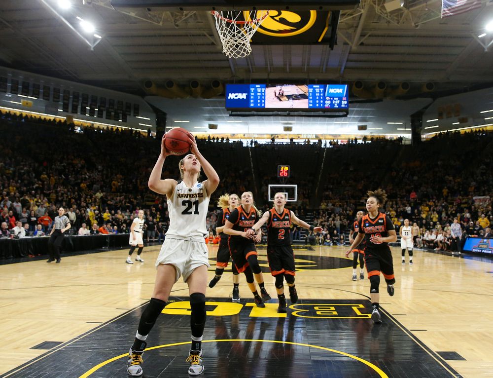 Iowa Hawkeyes forward Hannah Stewart (21) makes a basket during the first round of the 2019 NCAA Women's Basketball Tournament at Carver Hawkeye Arena in Iowa City on Sunday, Dec. 31, 2000. (Stephen Mally for hawkeyesports.com)