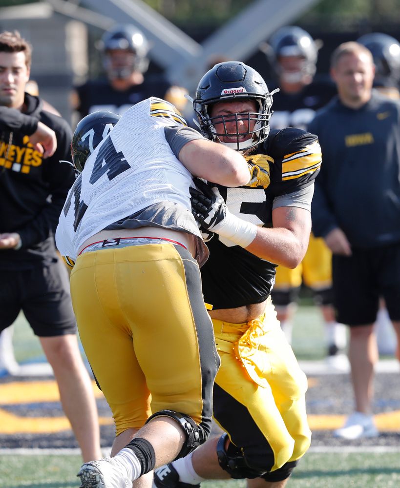 Iowa Hawkeyes offensive lineman Jeff Jenkins (75) and defensive lineman Austin Schulte (74) during camp practice No. 17 Wednesday, August 22, 2018 at the Kenyon Football Practice Facility. (Brian Ray/hawkeyesports.com)