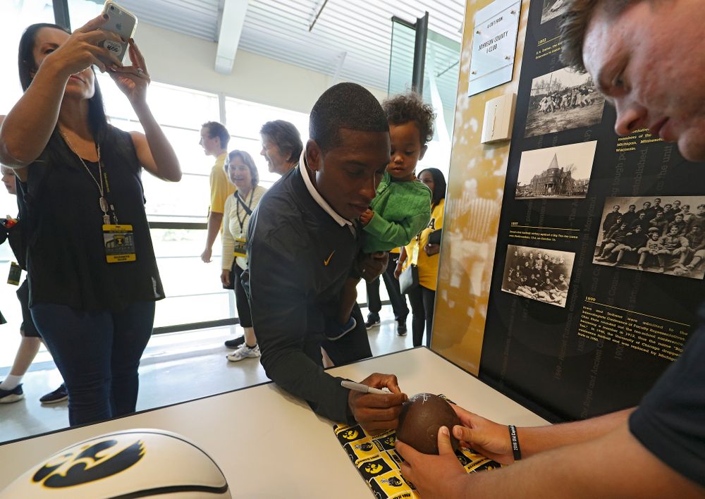 2019 University of Iowa Athletics Hall of Fame inductee Jeremy Allen signs a shot put ball at the University of Iowa Athletics Hall of Fame in Iowa City on Friday, Aug 30, 2019. (Stephen Mally/hawkeyesports.com)