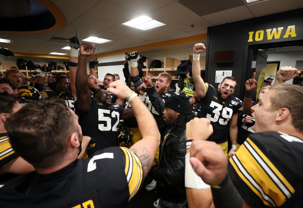 Honorary captain Bob Sanders sings the Fight Song with the Iowa Hawkeyes following their game against the Purdue Boilermakers Saturday, October 19, 2019 at Kinnick Stadium. (Brian Ray/hawkeyesports.com)