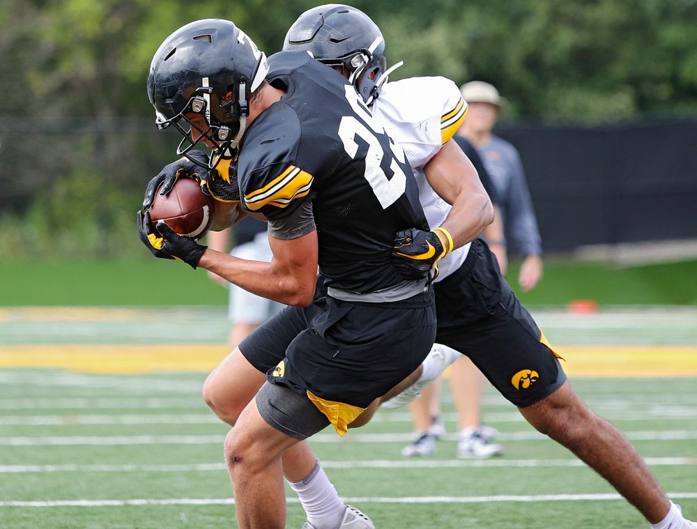 Iowa Hawkeyes wide receiver Jackson Ritter (29) pulls in a pass around defensive back Sebastian Castro (29) during Fall Camp Practice No. 15 at the Hansen Football Performance Center in Iowa City on Monday, Aug 19, 2019. (Stephen Mally/hawkeyesports.com)