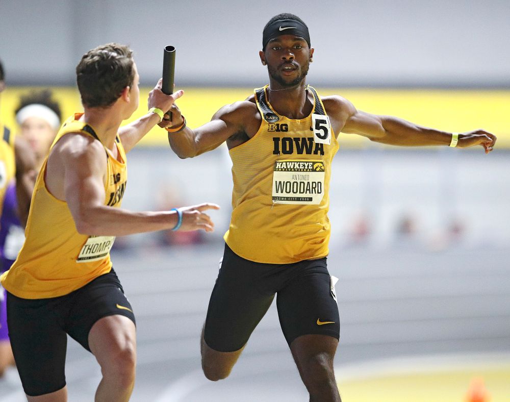 Iowa’s Antonio Woodard (right) hands the baton off to Chris Thompson as they run the men’s 1600 meter relay event during the Hawkeye Invitational at the Recreation Building in Iowa City on Saturday, January 11, 2020. (Stephen Mally/hawkeyesports.com)