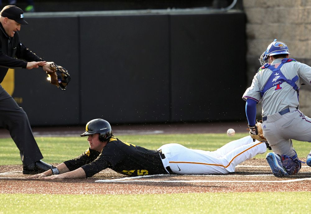 Iowa first baseman Peyton Williams (45) scores a run after a throwing error during the third inning of their college baseball game at Duane Banks Field in Iowa City on Tuesday, March 10, 2020. (Stephen Mally/hawkeyesports.com)