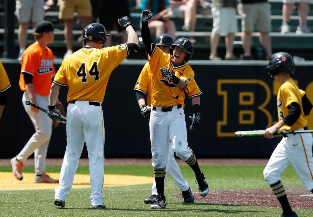 Iowa Hawkeyes infielder Mitchell Boe (4) hits an inside the park home run against the Oklahoma State Cowboys Sunday, May 6, 2018 at Duane Banks Field. (Brian Ray/hawkeyesports.com)