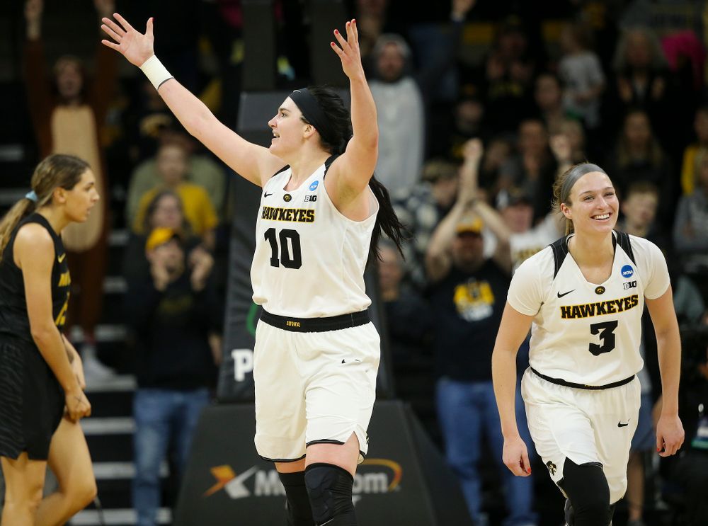 Iowa Hawkeyes center Megan Gustafson (10) pumps up the crowd as guard Makenzie Meyer (3) looks on during the fourth quarter of their second round game in the 2019 NCAA Women's Basketball Tournament at Carver Hawkeye Arena in Iowa City on Sunday, Mar. 24, 2019. (Stephen Mally for hawkeyesports.com)