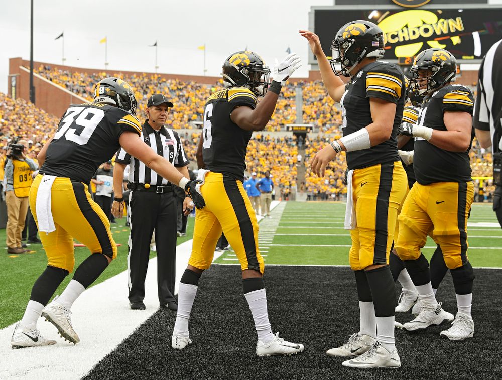 Iowa Hawkeyes wide receiver Ihmir Smith-Marsette (6) celebrates his 14-yard touchdown run with quarterback Nate Stanley (4) during third quarter of their game at Kinnick Stadium in Iowa City on Saturday, Sep 28, 2019. (Stephen Mally/hawkeyesports.com)