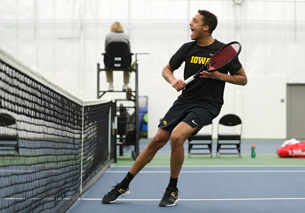 Iowa’s Oliver Okonkwo celebrates a point during his singles match at the Hawkeye Tennis and Recreation Complex in Iowa City on Friday, March 6, 2020. (Stephen Mally/hawkeyesports.com)
