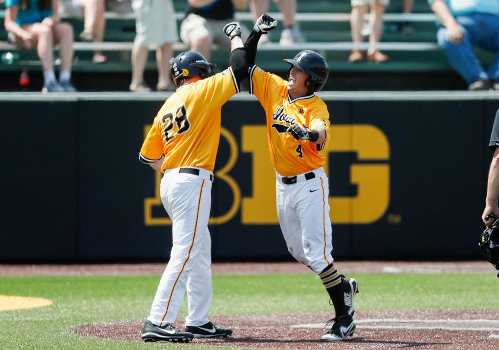 Iowa Hawkeyes infielder Mitchell Boe (4) celebrates and inside the park home run against the Oklahoma State Cowboys Sunday, May 6, 2018 at Duane Banks Field. (Brian Ray/hawkeyesports.com)