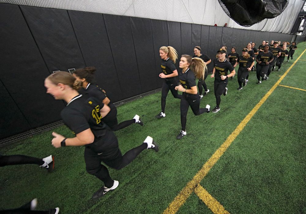 The Hawkeyes run to warm up for practice during Iowa Softball Media Day at the Hawkeye Tennis and Recreation Complex in Iowa City on Thursday, January 30, 2020. (Stephen Mally/hawkeyesports.com)