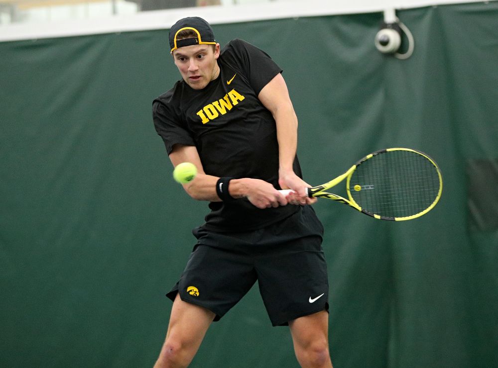 Iowa’s Joe Tyler returns a shot during his doubles match at the Hawkeye Tennis and Recreation Complex in Iowa City on Thursday, January 16, 2020. (Stephen Mally/hawkeyesports.com)