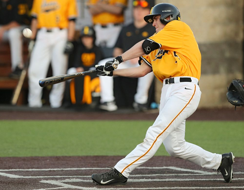 Iowa Hawkeyes designated hitter Austin Martin (34) hits an RBI single during the eighth inning of their game against Northern Illinois at Duane Banks Field in Iowa City on Tuesday, Apr. 16, 2019. (Stephen Mally/hawkeyesports.com)