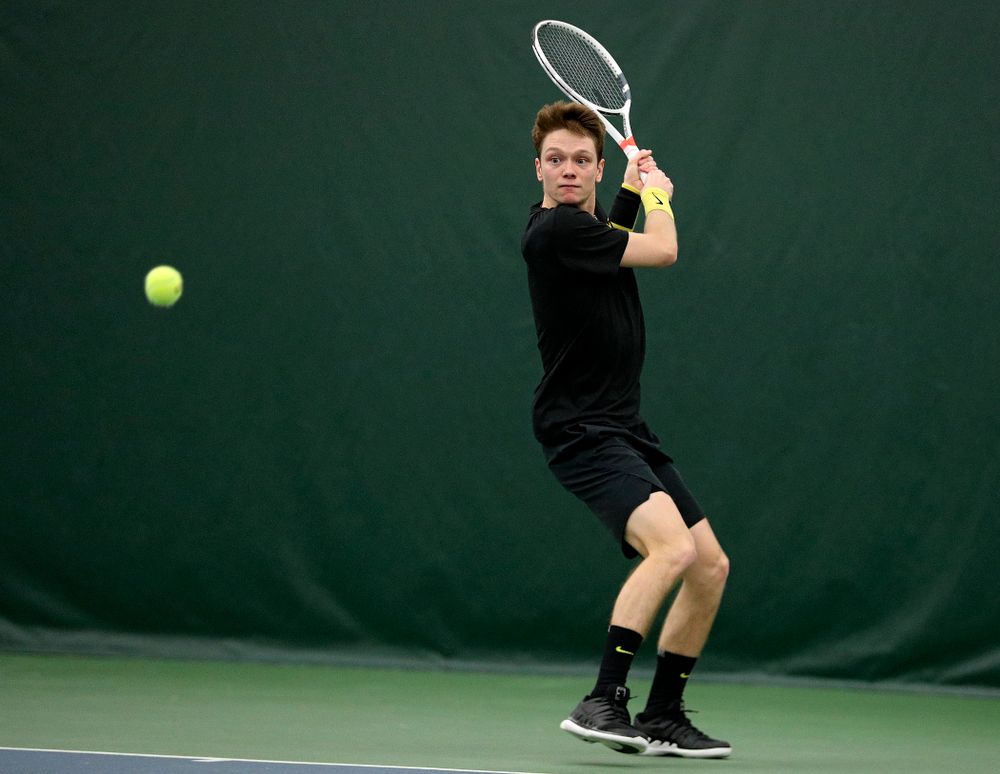 Iowa’s Jason Kerst returns a shot during his singles match at the Hawkeye Tennis and Recreation Complex in Iowa City on Friday, March 6, 2020. (Stephen Mally/hawkeyesports.com)