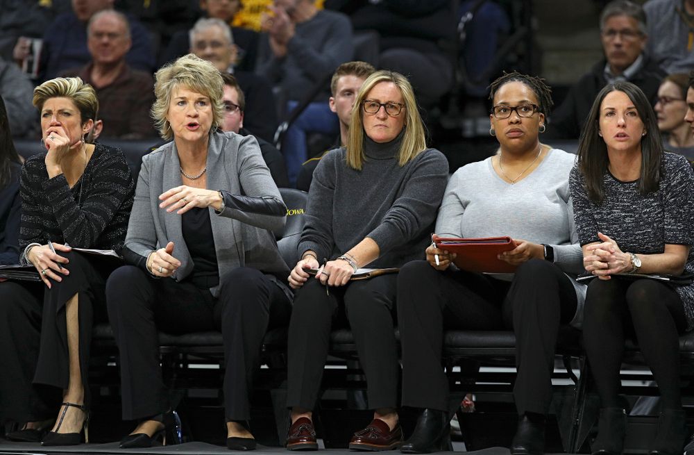 Iowa associate head coach Jan Jensen (from left), head coach Lisa Bluder, special assistant to the head coach Jenni Fitzgerald, assistant coach Raina Harmon, and assistant coach Abby Stamp during the third quarter of their game at Carver-Hawkeye Arena in Iowa City on Sunday, January 12, 2020. (Stephen Mally/hawkeyesports.com)