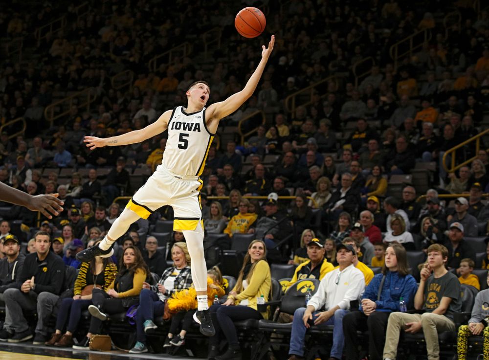 Iowa Hawkeyes guard CJ Fredrick (5) pulls in a pass during the first half of their game at Carver-Hawkeye Arena in Iowa City on Friday, Nov 8, 2019. (Stephen Mally/hawkeyesports.com)