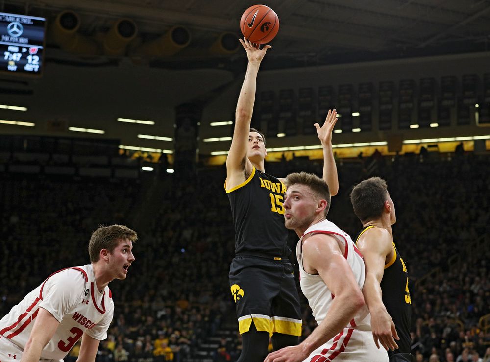 Iowa Hawkeyes forward Ryan Kriener (15) scores a basket during the first half of their game at Carver-Hawkeye Arena in Iowa City on Monday, January 27, 2020. (Stephen Mally/hawkeyesports.com)