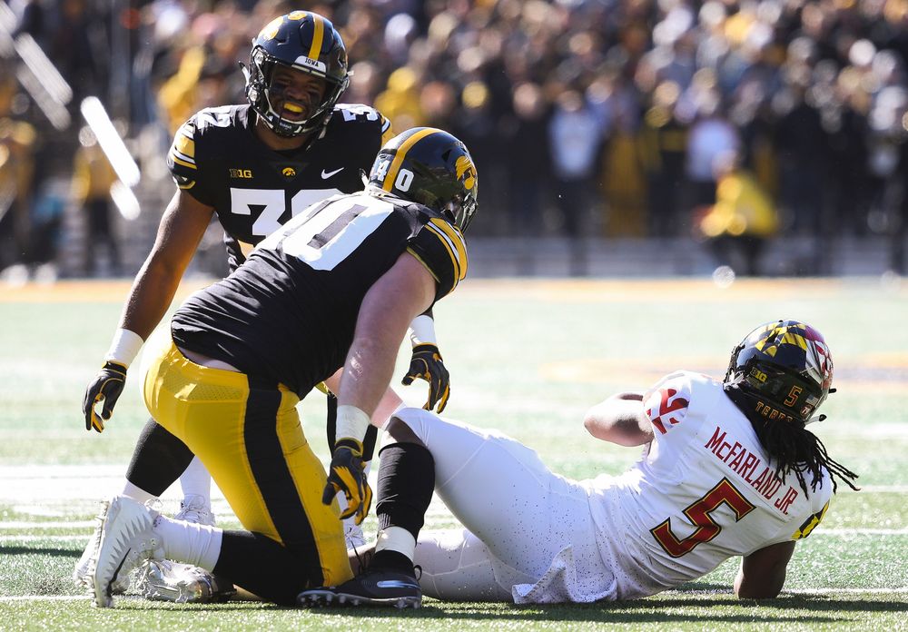 Iowa Hawkeyes linebacker Djimon Colbert (32) reacts after Iowa Hawkeyes defensive end Parker Hesse (40) makes a tackle for loss during a game against Maryland at Kinnick Stadium on October 20, 2018. (Tork Mason/hawkeyesports.com)