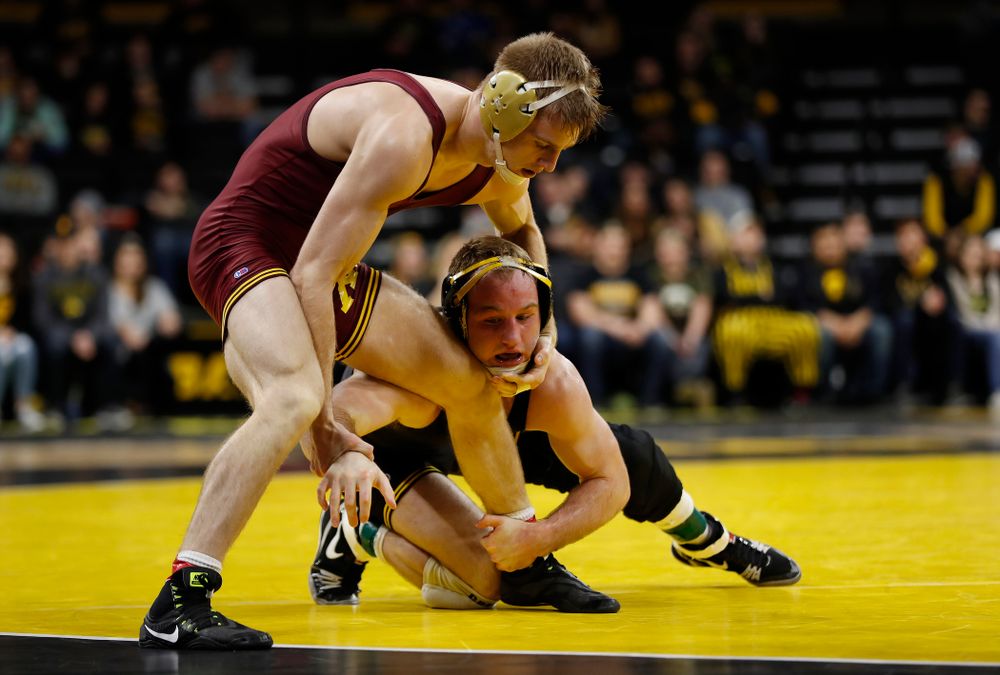 Iowa's Alex Marinelli wrestles Minnesota's Nick Wanzek at 165 pounds 