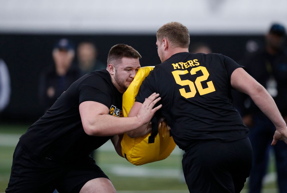 Iowa Hawkeyes offensive lineman Ike Boettger (75) and offensive lineman Boone Myers (52) during the team's annual pro day Monday, March 26, 2018 at the Hansen Football Performance Center. (Brian Ray/hawkeyesports.com)