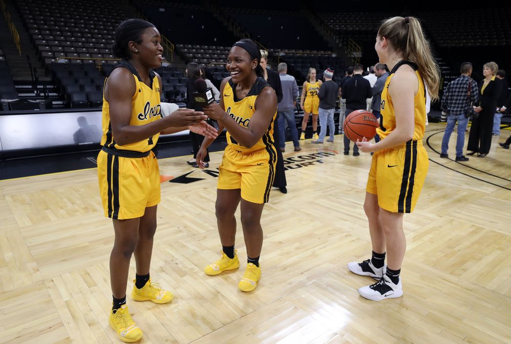 Iowa Hawkeyes guard Tomi Taiwo  (1), guard Zion Sanders (21), and guard Kate Martin (20) during the teamÕs annual media day Thursday, October 24, 2019 at Carver-Hawkeye Arena. (Brian Ray/hawkeyesports.com)