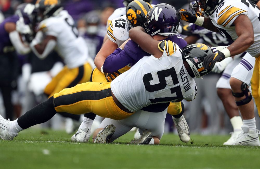 Iowa Hawkeyes linebacker Dillon Doyle (43) and defensive end Chauncey Golston (57) against the Northwestern Wildcats Saturday, October 26, 2019 at Ryan Field in Evanston, Ill. (Brian Ray/hawkeyesports.com)