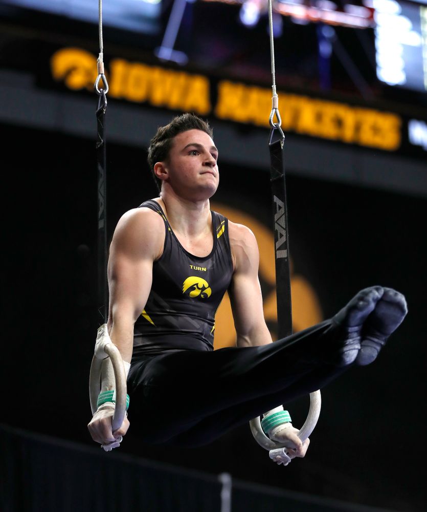 Jake Brodarzon competes on the rings against Illinois 